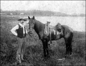 Tom Johnson holding the reins of his horse: Orlando, Florida (189-) - Florida Cracker History